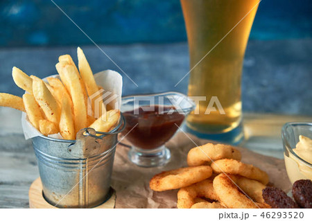a variety of snacks for light beer in a glass a variety of snacks for light beer in a glass 46293520
