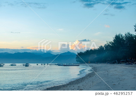 morning on the beach by the ocean at the foot of the mountain morning on the beach by the ocean at the foot of the mountain 46295257