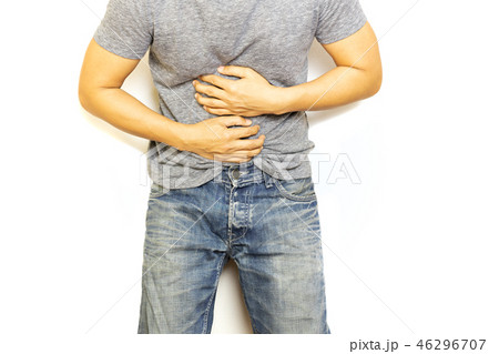 Man with stomach pain hand holding his aching belly isolated. Man with stomach pain hand holding his aching belly isolated. 46296707
