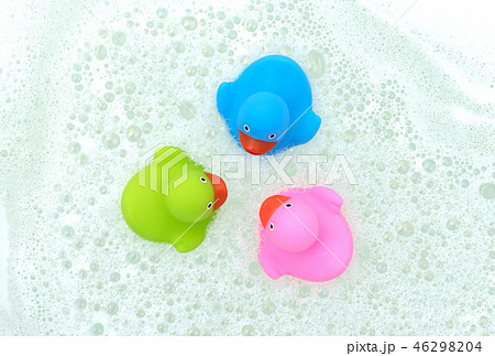 Pink, green and blue duck in a bathtub 46298204