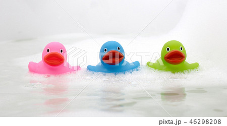 Pink, green and blue duck in a bathtub 46298208