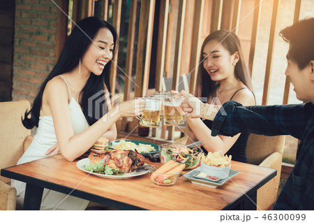 Group of asian people cheering beer at restaurant 46300099