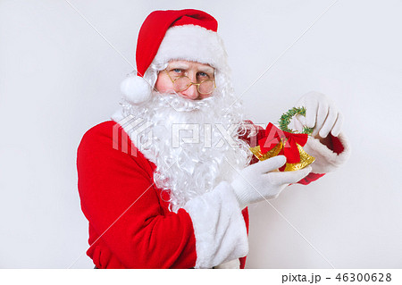 Santa Claus ringing a bell on a white background . Christmas time. Santa Claus ringing a bell on a white background . Christmas time. 46300628