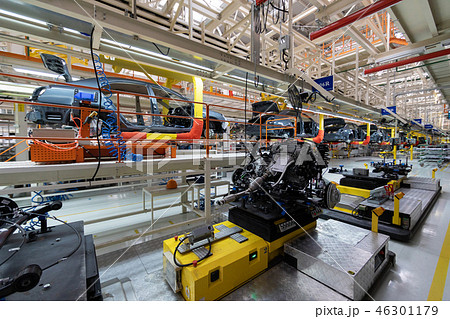 Transfer of car body. Robotic equipment makes Assembly of tcar. Modern car Assembly at factory 46301179