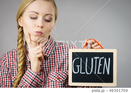 Woman holding board with gluten sign 46301709