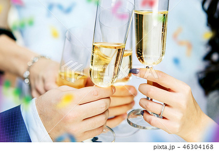 Celebration. Hands holding the glasses of champagne and wine making a toast. 46304168