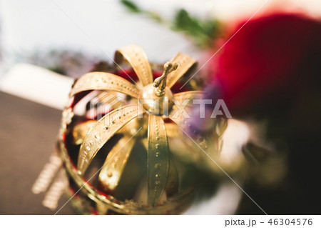 Golden crowns lying on the table in church Golden crowns lying on the table in church 46304576