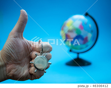 hand showing good thumbs up gesture with globe hand showing good thumbs up gesture with globe 46306412