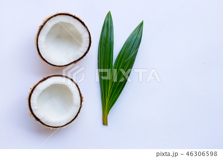 Coconut with leaf on white background. Coconut with leaf on white background. 46306598