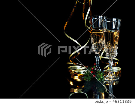 Crystal glasses with champagne on black background 46311839