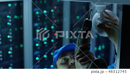 Technician installing security camera 46312745