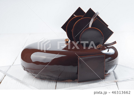 Chocolate cake on a white wooden table 46313662