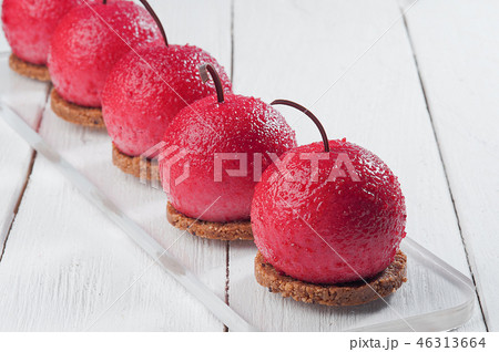 round cakes on white wooden table. cherry shape 46313664