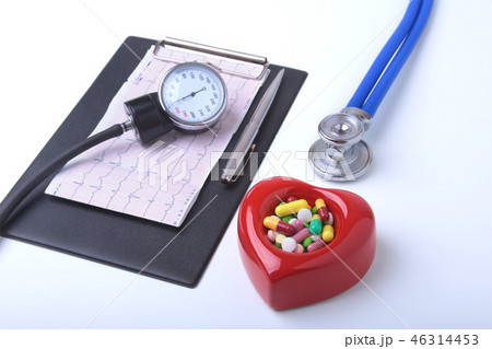 RX prescription, Red heart, asorted pils and a stethoscope on white background 46314453