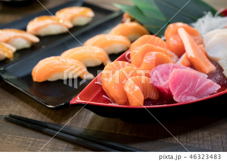 Mixed sliced fish sashimi on ice in white bowl. Mixed sliced fish sashimi on ice in white bowl. 46323483