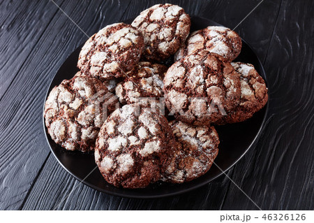 Chocolate Crinkle cookies on a plate, close-up 46326126