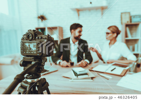 Journalist is interviewing a businessman on video 46326405