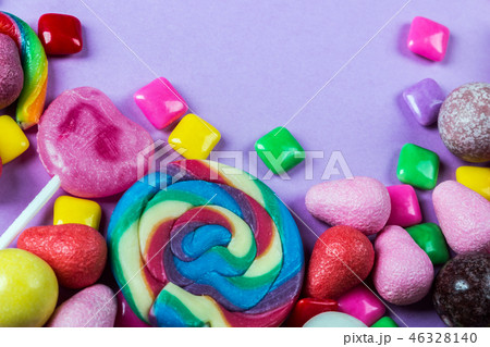 different colors of candy, lollipops, chewing gum, marshmallow a 46328140