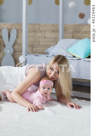 mother playing with her baby mother playing with her baby 46329463