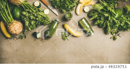 Ingredients for making green smoothie over concrete background, wide composition Ingredients for making green smoothie over concrete background, wide composition 46329751