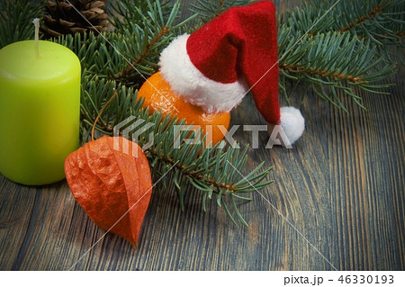 Christmas background with Santa hat and candle Christmas background with Santa hat and candle 46330193