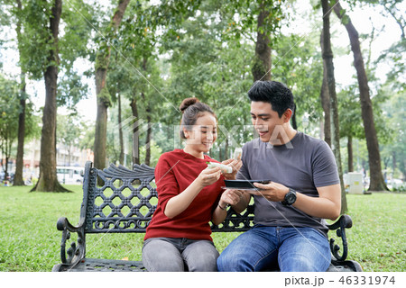 Couple eating street food Couple eating street food 46331974