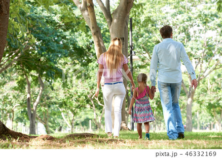 Family walking in park 46332169