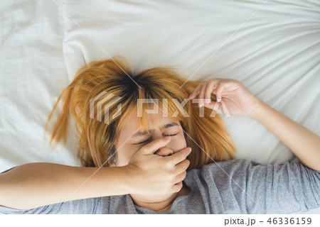 Asian woman sleeping in bed in the morning.  46336159