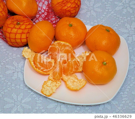 peeled mandarin divided into slices peeled mandarin divided into slices 46336629
