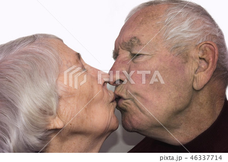 The senior woman kissing old man 46337714