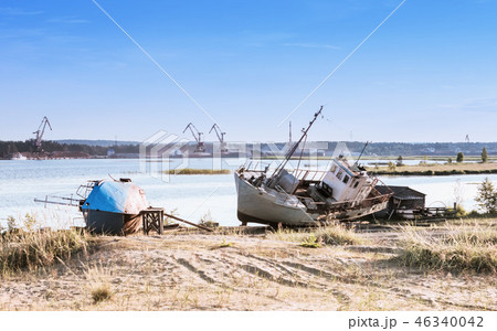 Old Ships On The Riverbank Against A River Port 46340042