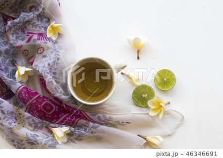 hot healthy drinks honey lemon and scarf of woman 46346691