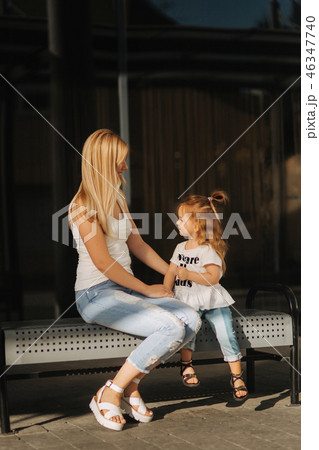 Mother and daughter outdoors in city. playing and having fun. Fashion happy mother and child 46347740