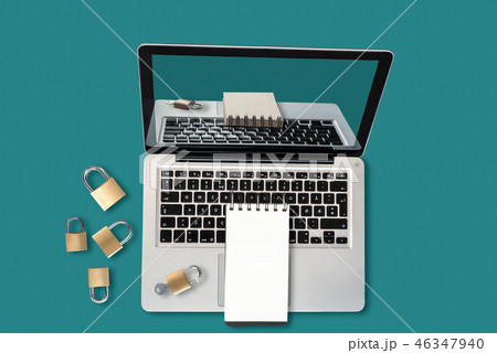 Laptop, padlocks and a blank notepad Laptop, padlocks and a blank notepad 46347940