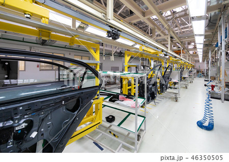 car door on conveyor. Robotic equipment makes Assembly of car. Modern car Assembly at factory 46350505