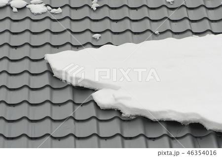 Metal tiling roof in winter season covered snow Metal tiling roof in winter season covered snow 46354016