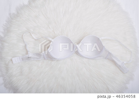 White bra on white fur. Inner side. Lingerie 46354058
