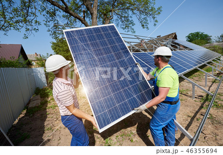 Stand-alone exterior solar panel system installation, renewable green energy generation concept. Stand-alone exterior solar panel system installation, renewable green energy generation concept. 46355694