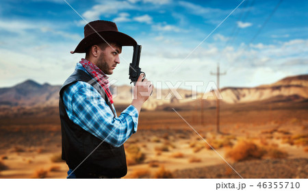 Cowboy with revolver, gunfight in gesert valley 46355710