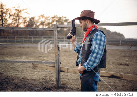 Cowboy with revolver, gunfight in gesert valley 46355712