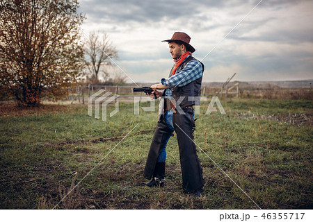 Brutal cowboy with revolver, gunfight on ranch 46355717