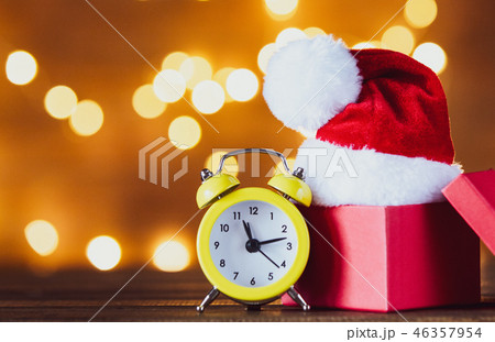 Vintage alarm clock with Santa Claus hat Vintage alarm clock with Santa Claus hat 46357954