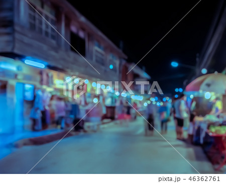 Blurred image of tourists walking at night market  46362761