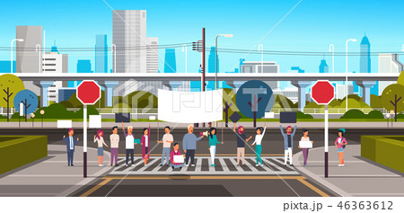 people crowd holding placard and megaphone on crosswalk modern city street skyscraper downtown road 46363612