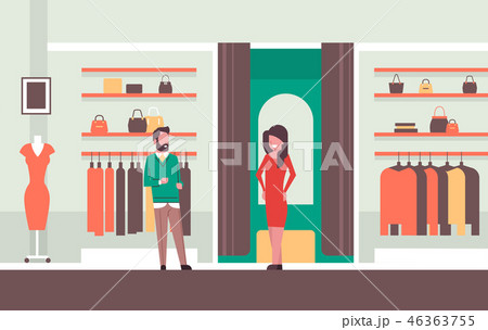man seller consultant near woman trying on new dress elegant woman looking at mirror fashion shop 46363755