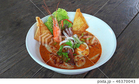 Seafood spicy noodle soup serve in white bowl Seafood spicy noodle soup serve in white bowl 46370043