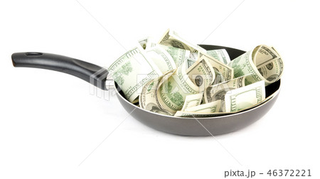 dollars in frying pan 46372221