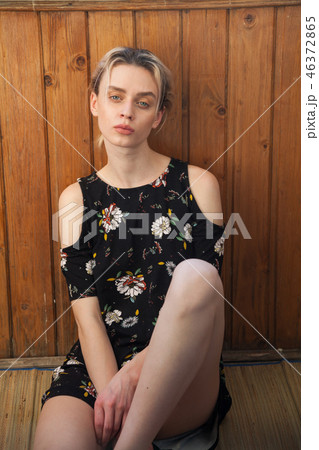 beautiful fashionable woman blonde in dress with flowers on the street beautiful fashionable woman blonde in dress with flowers on the street 46372865