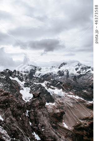Snow cliff behind cloud and Mount Titlis Engelberg 46373588