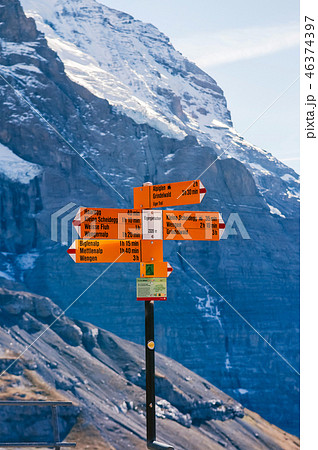 Swiss alps view and hiking trail route signs 46374397